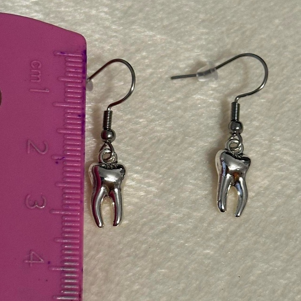 Goth silver tooth charms earrings.